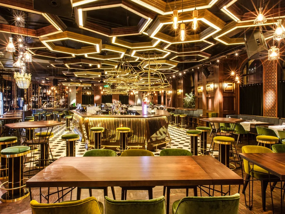 Uanderful restaurant in Bucharest, with its ceiling of illuminated hexagons